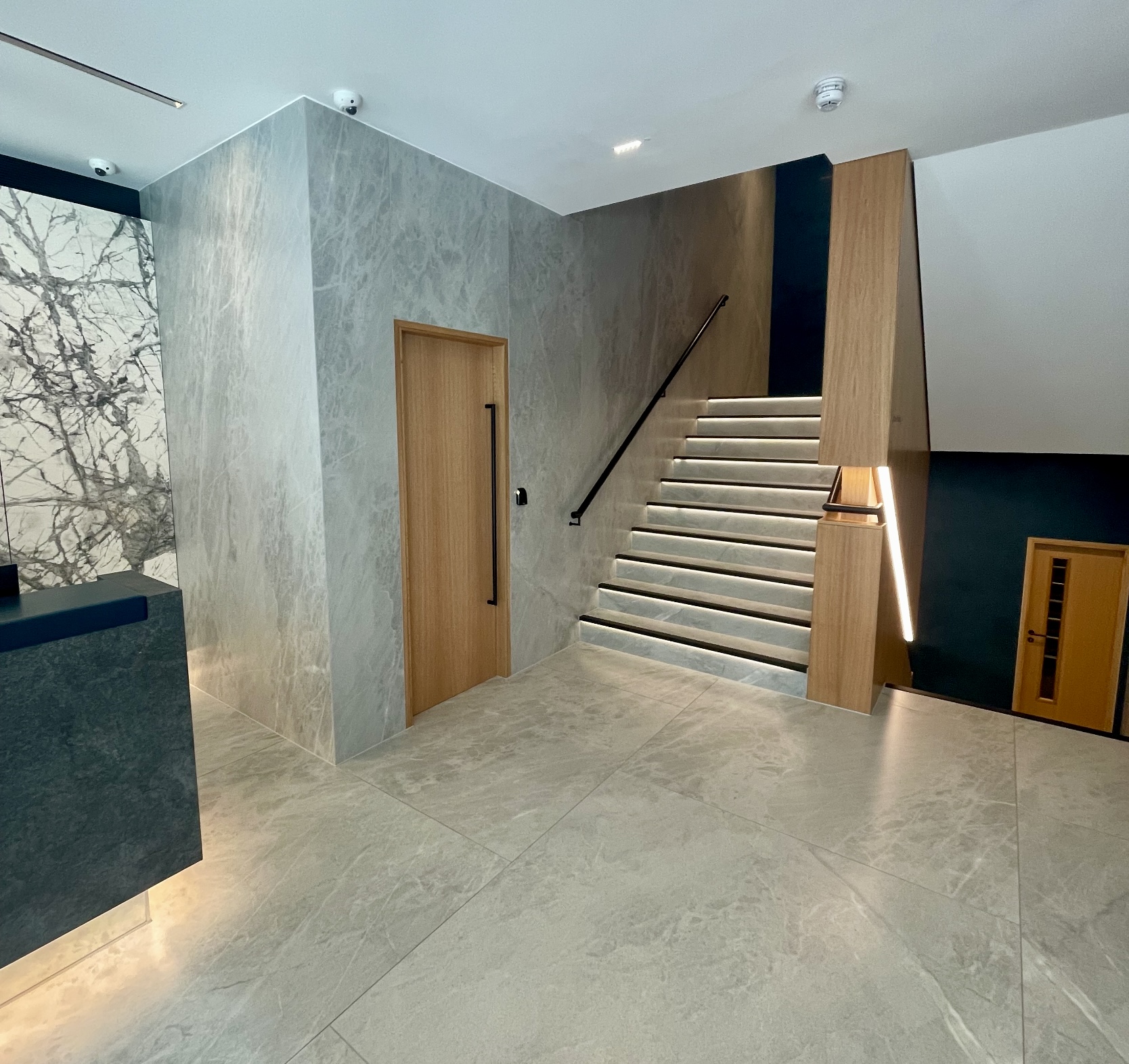 Office block development tiled reception and stairs.  Spectrum 