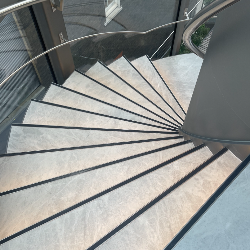 London spiral staircase installation Showcase photograph spectrum stone and ceramic 