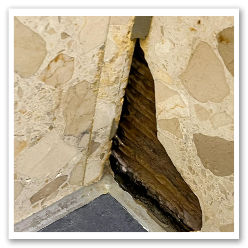 Before photo of the damaged tile ready for magic man repairs.