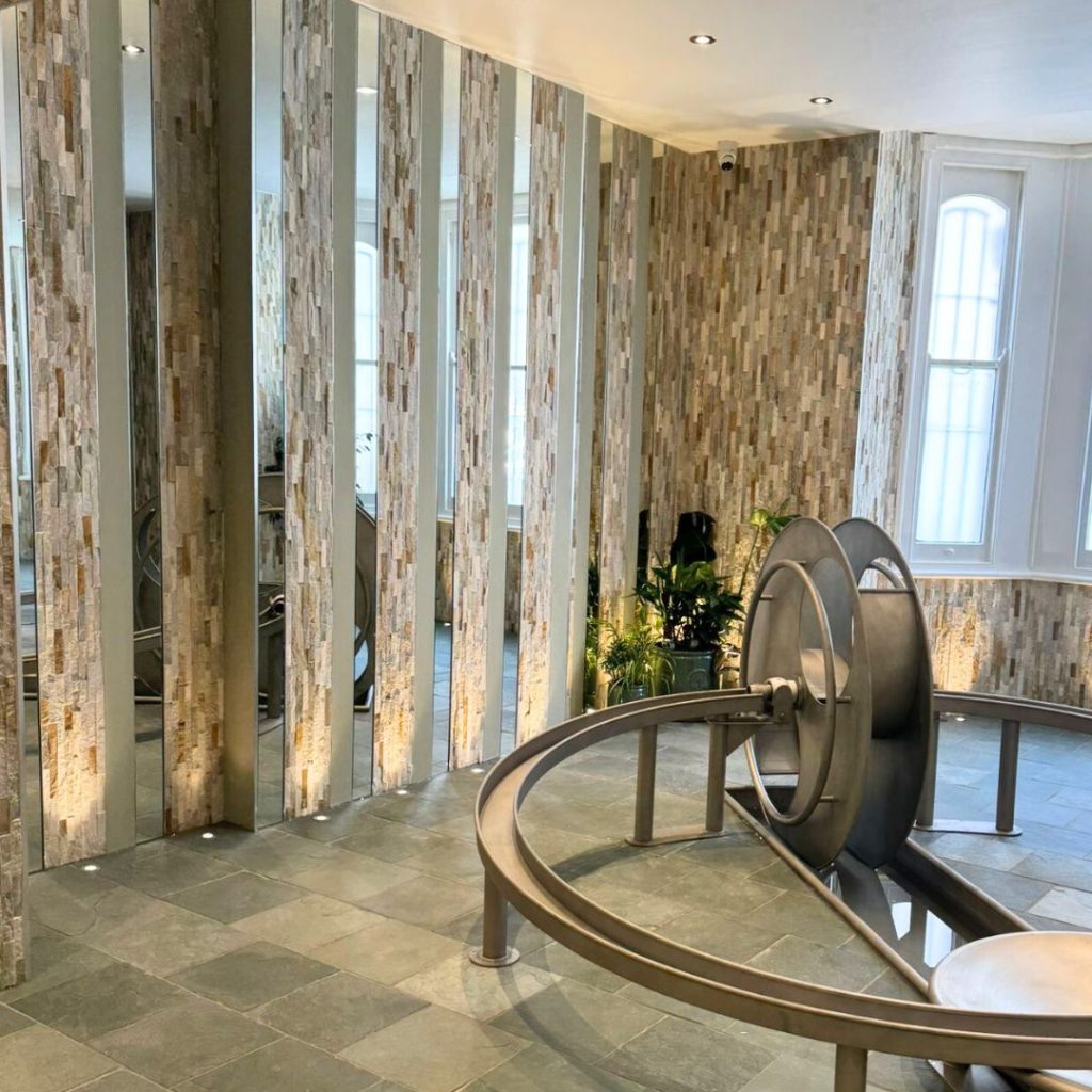 Slate floor and Splitface stone walls in a water play area in a nursery London. 